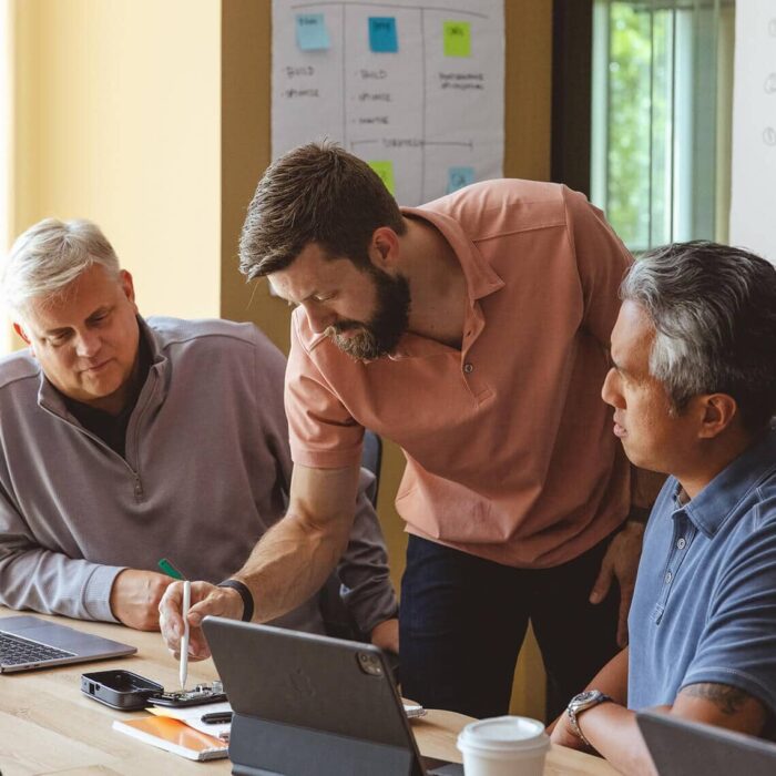 Engineering leader explaining IoT hardware to clients