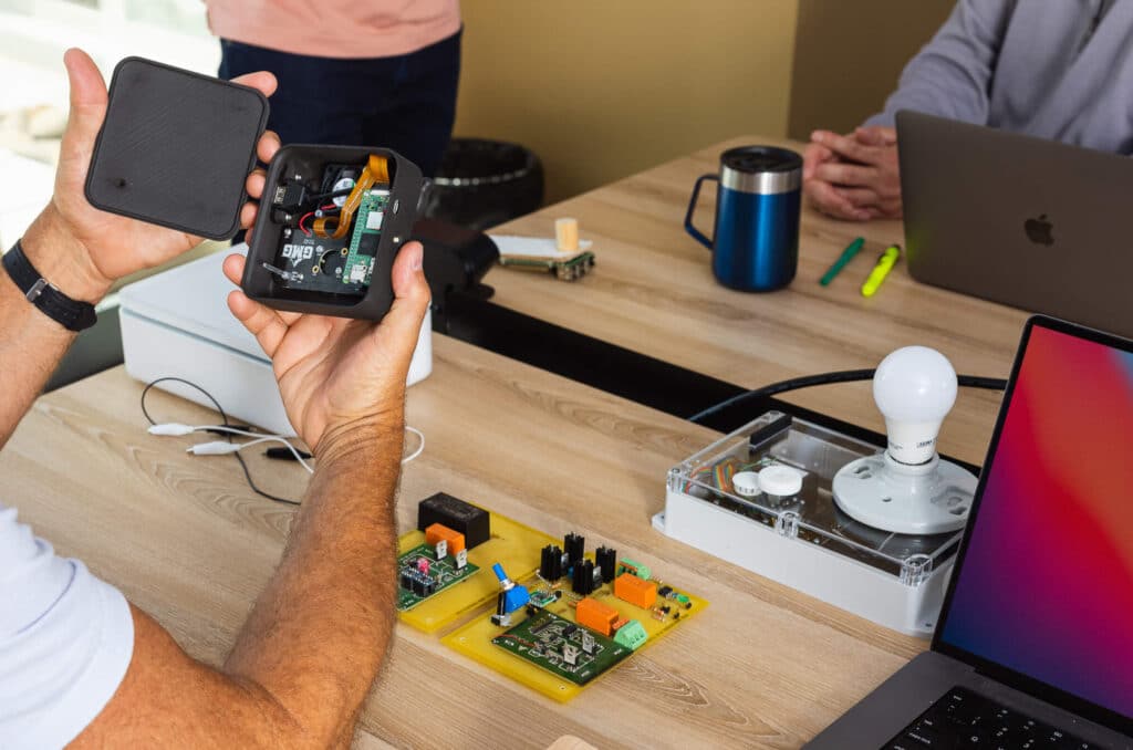 Mechanical Engineer Holding an IoT Device