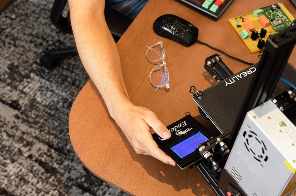 Developer holding a 3d printer